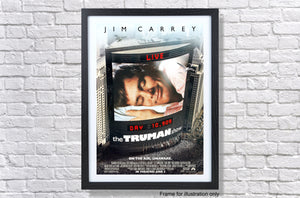 a movie poster hanging on a brick wall